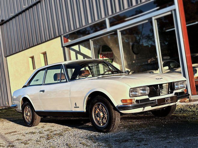 Cliquer pour voir la photo suivante Peugeot 504 C12 4cyl. 2 litres blanc de 1977