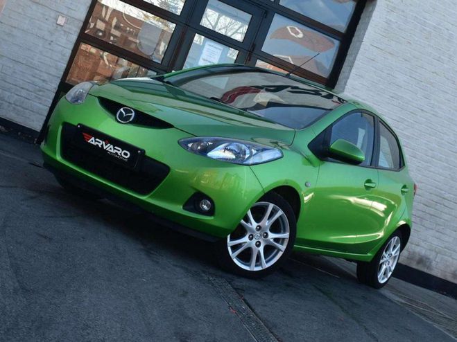 Cliquer pour voir la photo suivante Mazda 2 1.3i Sport Verw Zetels Airco Garantie Vert Métallisé de
