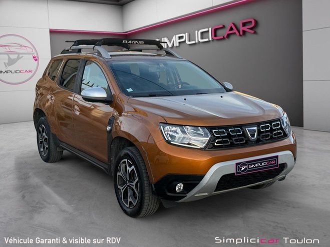 Cliquer pour voir la photo suivante Dacia Duster Blue dCi 115 4x2 Prestige garantie 12 mo Orange de 2020
