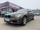 Vient d'&ecirc;tre vendu - BMW Serie 1 (F20) 118I LOUNGE BVA8 5P CUIR BEIGE 5P  2014 voiture occasion &agrave; Coigni�res (78)